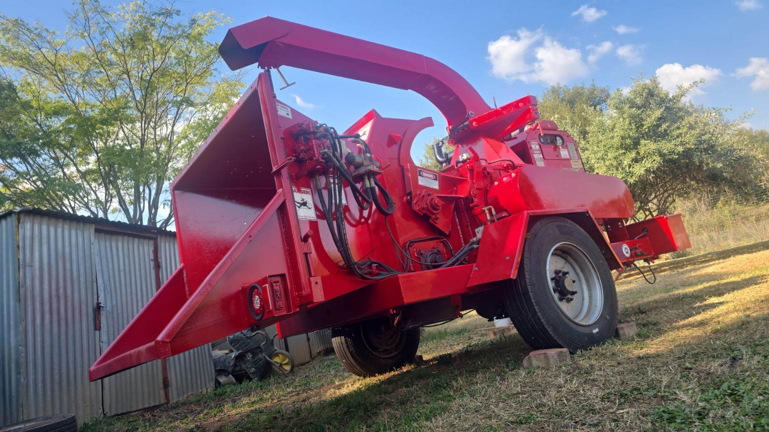 The red ChipperMan chipper unit on site